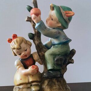 BOY PICKING FRUIT FIGURINE